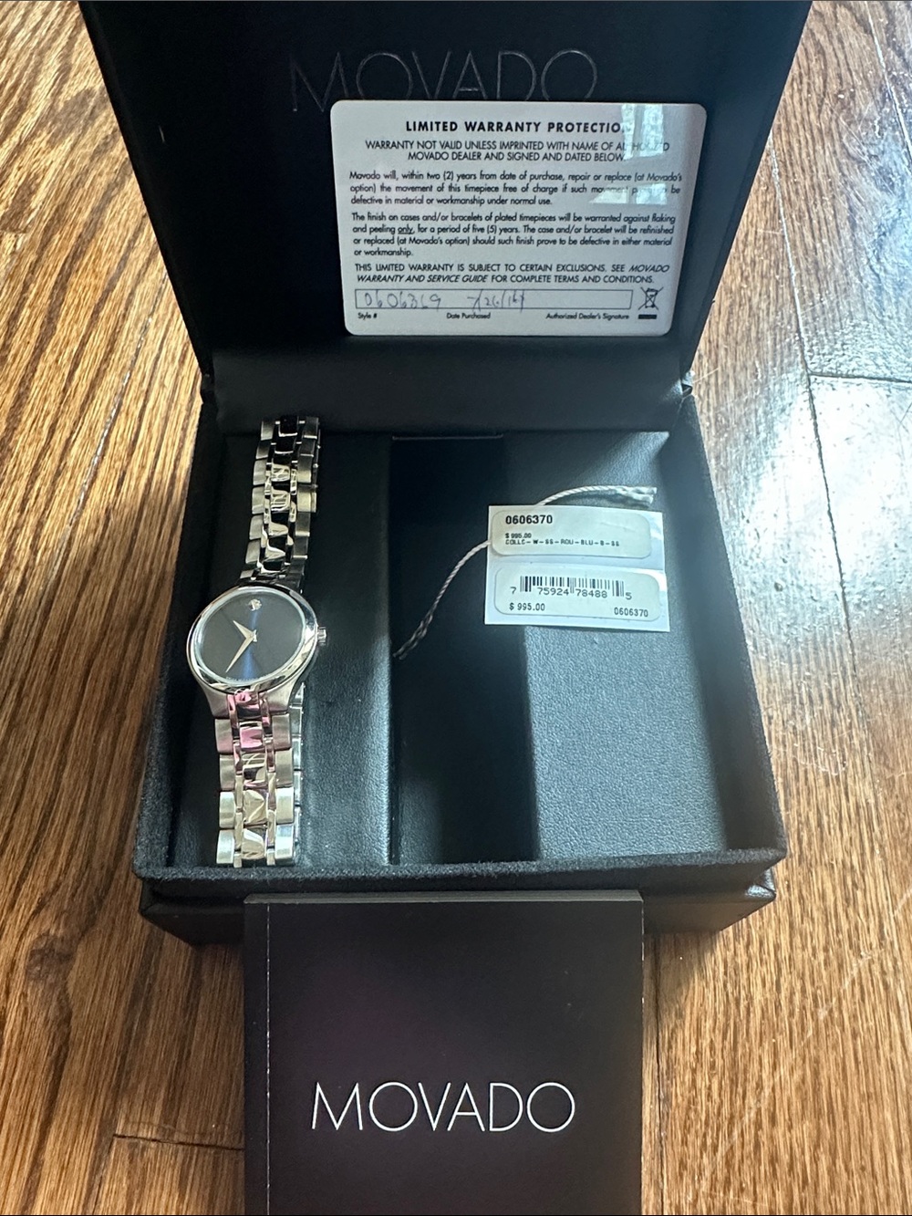 Movado Silver Bracelet Watch with Black Dial and Gold Hands